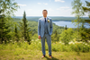 Groom wearing a custom light blue linen-wool blend suit for a summer wedding in Northern Michigan.